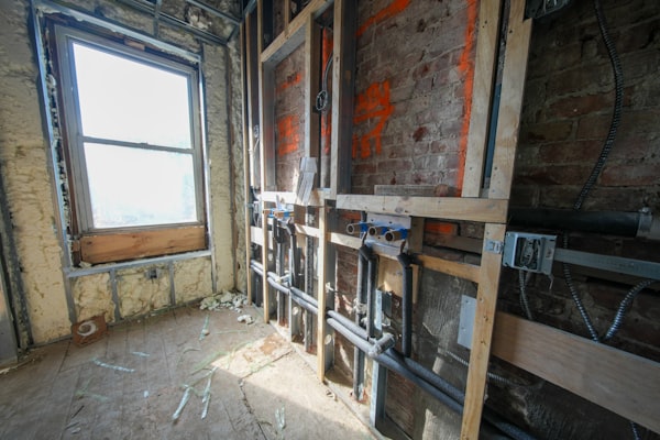 Interior room under construction with exposed electrical wiring