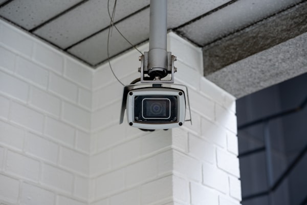 Security camera mounted on commercial building